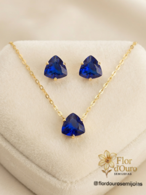 Conjunto pedra em zirconia formato triangular, azul.